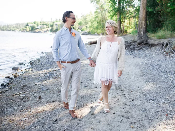 Carol and he husband walking on the beach