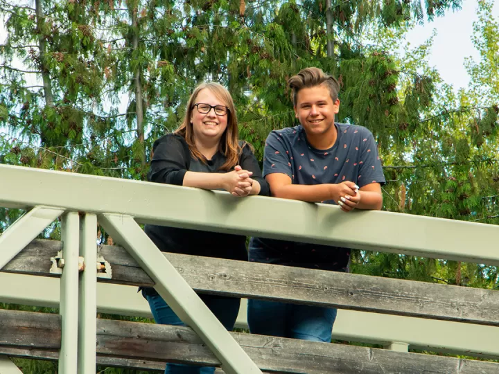 Val on a bridge with her son