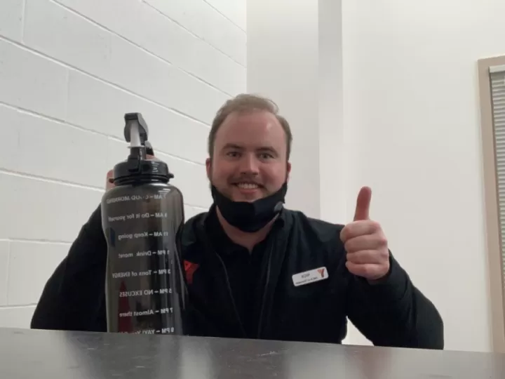 man holding up a water bottle